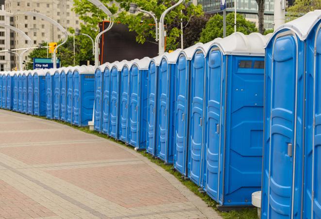 colorful portable restrooms available for rent at a local fair or carnival in Yonkers